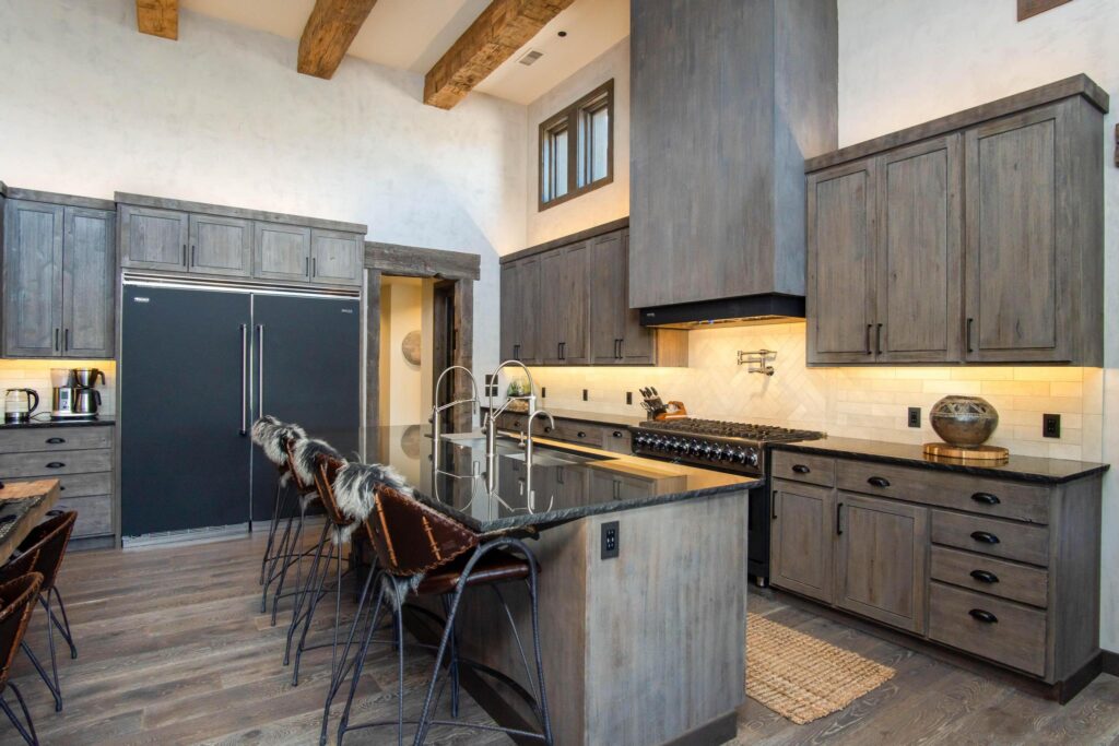 Kitchen with a long island, range and full-height cabinetry