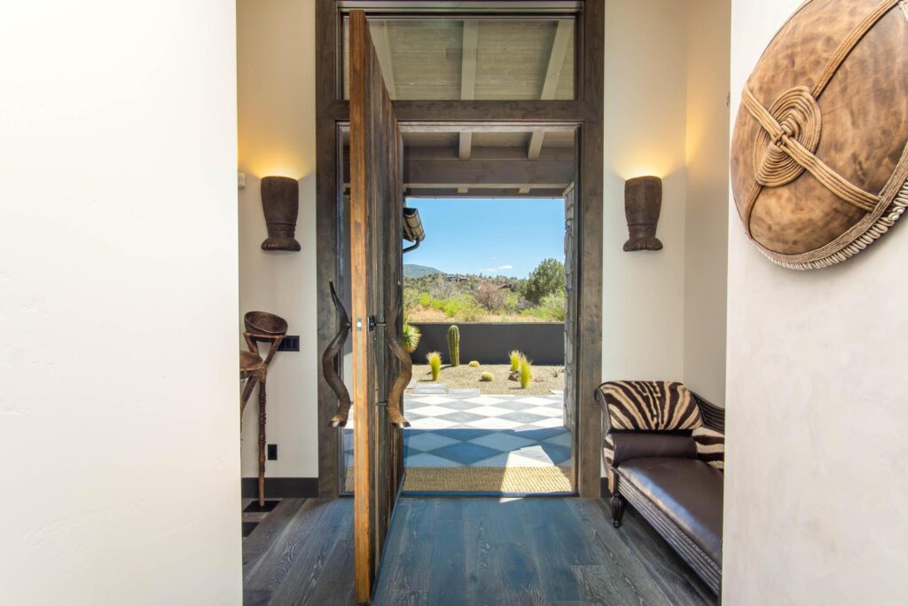 Entry looking through the front door to the checkerboard terrace beyond