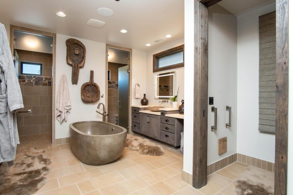The bathroom from the doorway, tub and vanity along one wall