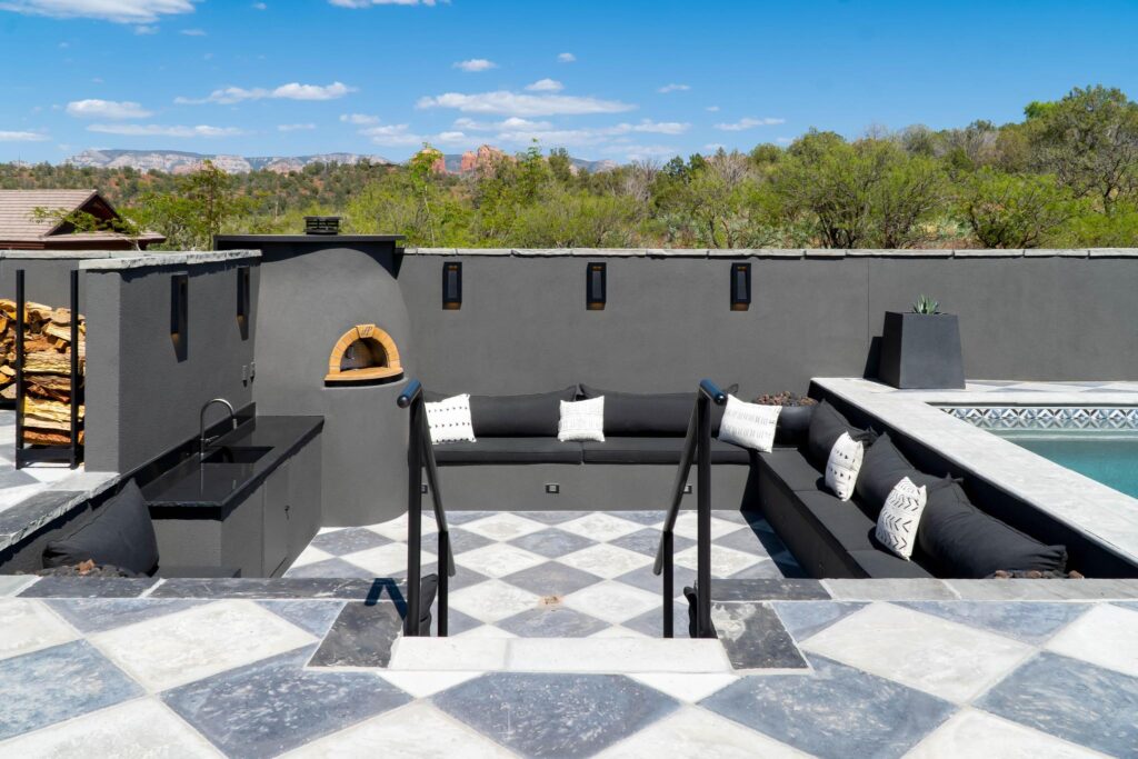 Sunken seating area beside the pizza oven, cut into the pool terrace