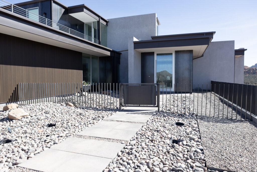 Courtyard between the wings, with a fire pit set in the gravel