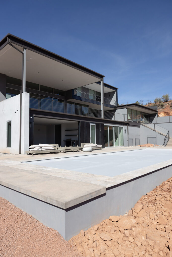 The rear elevation above the pool, two levels opening to the terrace