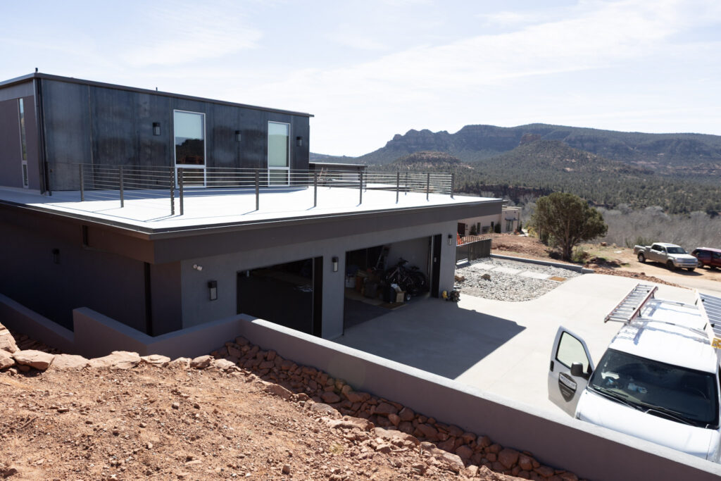 The garage level and forecourt, with the terrace above