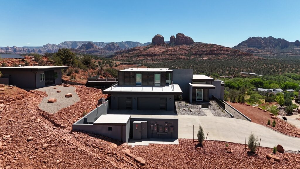 Birds Nest on its hilltop, roof terrace above and red rock beyond